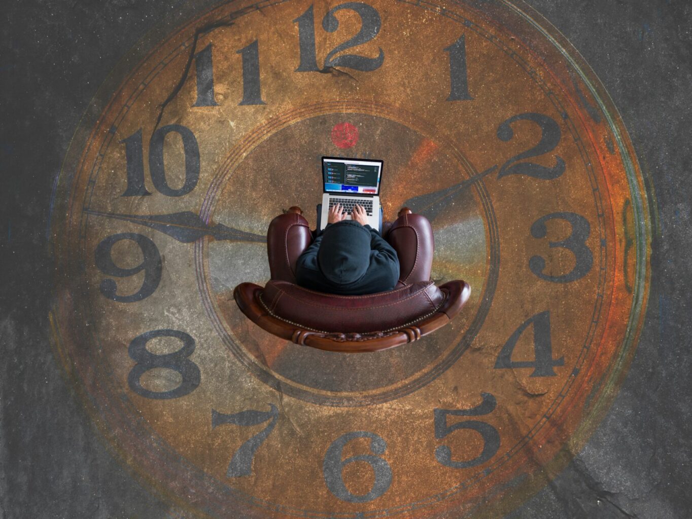 a person outsourcing life admin while sat at a laptop over a picture of a clock