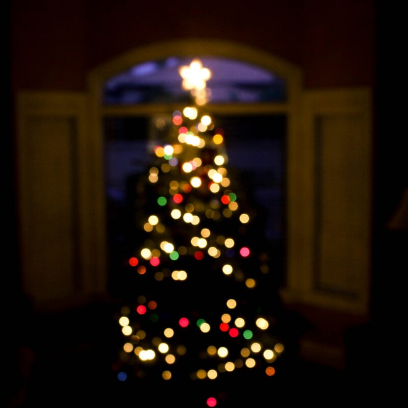 Out of focus Christmas tree with glowing lights